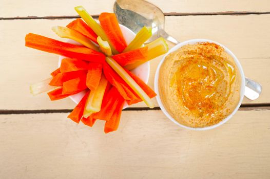 fresh hummus dip with raw carrot and celery arab middle eastent healthy food 