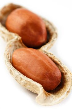 Peanuts isolated on white background. Peeled Peel and Scarlup Macro Peanuts.