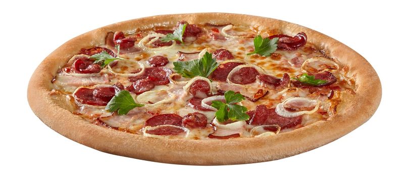Closeup of delicious meat pizza with bacon slices, spicy salami, hunting sausages and onions in melted mozzarella cheese garnished with fresh parsley isolated on white background