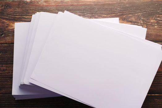 top view of stack of empty paper on table .