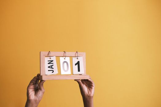 wooden calendar set on 1st of january ,