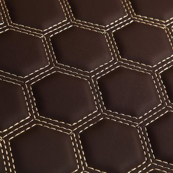 Texture of brown leather background with square pattern and stitch, macro