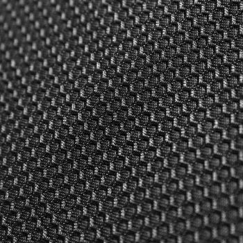 Texture of black leather background with honeycomb shape pattern, macro