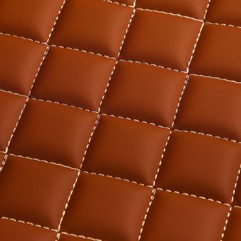 Texture of brown leather background with square pattern and stitch, macro