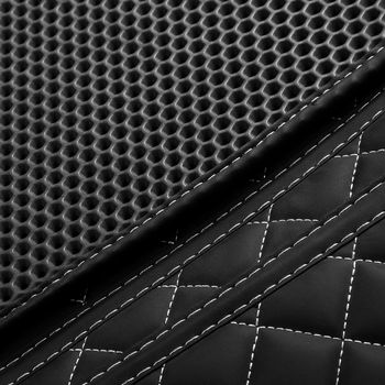 Texture of black leather background with square pattern and stitch, macro