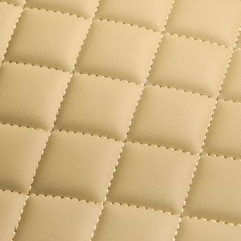 Texture of beige leather background with square pattern and stitch, macro