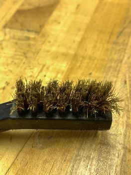 Used Brass Wire brush close up of the head . High quality photo