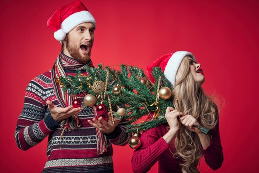 married couple emotions christmas holiday red background. High quality photo