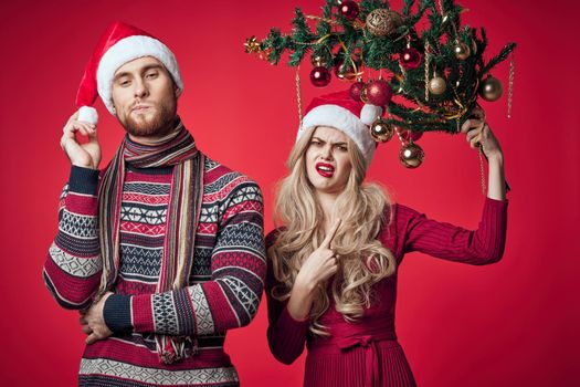 young couple in new year clothes together holiday emotions merry christmas. High quality photo