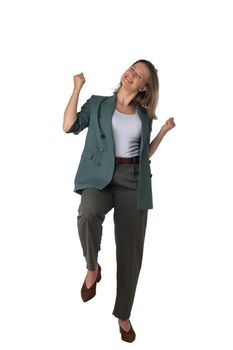 Happy smart business woman in suit smiling, holding hands in the air and celebrating, walking isolated on white background in studio