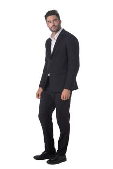 Handsome businessman wearing black suit standing isolated on white studio background