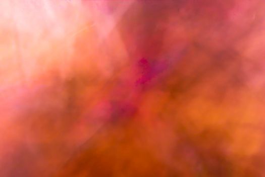 Horizontal orange-brown crumpled abstract background. Multi colored backdrop.
