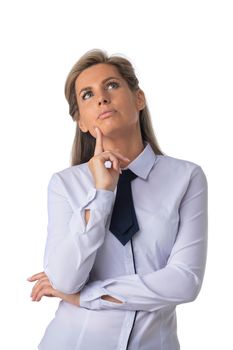 Portrait of pensive middle-aged business woman with hand on chin looking up at free space