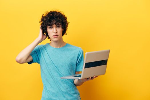 guy in blue t-shirts with laptop internet isolated backgrounds. High quality photo