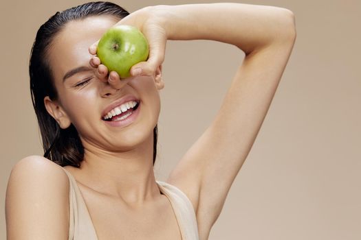 young woman green apple near face health close-up Lifestyle. High quality photo