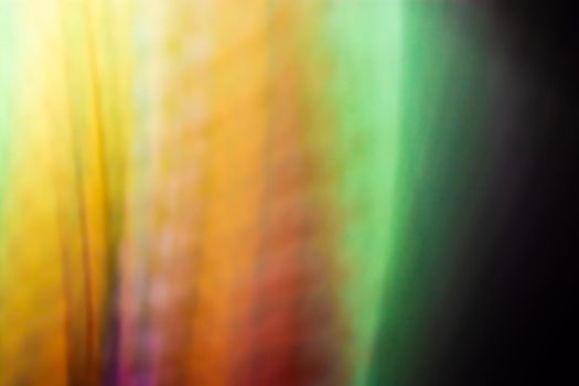 Rainbow multicolor abstract background. Slight blurring of light from lamps.