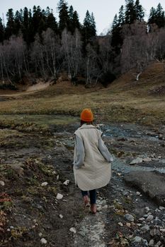 tourist in an orange hat nature autumn river lifestyle. High quality photo