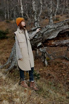 young woman in an orange hat nature autumn life style. High quality photo