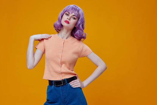 Pretty young female purple hair fashion posing glamor color background unaltered. High quality photo