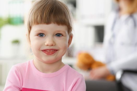 Portrait of little child at pediatrician reception, physical exam appointment. Healthy lifestyle, sickness, clinic test, high quality and trust concept