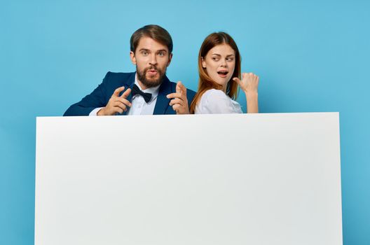 business man and woman billboard marketing fun emotions isolated background. High quality photo