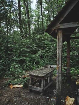 Log gazebo in forest for camping and weekend. Wooden Garden Gazebos for meal or relaxing with family and friends. Cropped image