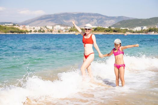 little girl and her mother have a good time at the seaside resort.