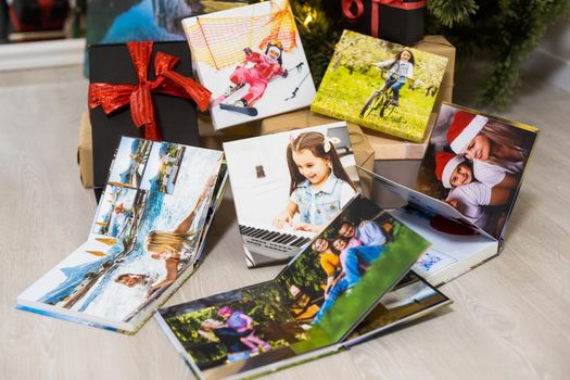 photo books near the christmas tree as a gift.