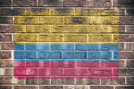 A Colombia flag on an old brick wall background