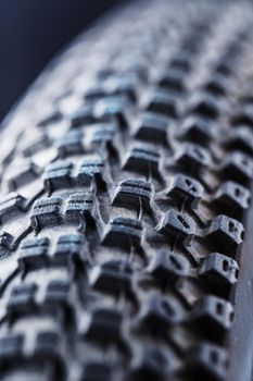 Bicycle wheel and tire close up on tread abstract. Macro.