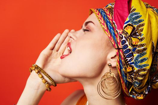 cheerful woman ethnicity multicolored headscarf makeup glamor Studio Model. High quality photo