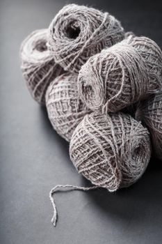 Balls of brown wool yarn made of natural wool. Needlework