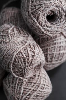 Light brown yarn made of natural sheep wool. Needlework