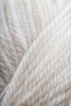 White wool yarn close-up in full screen. Macro