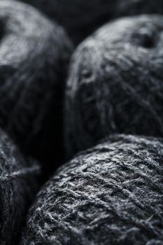 Gray yarn made of natural wool in balls of thread. Close-up