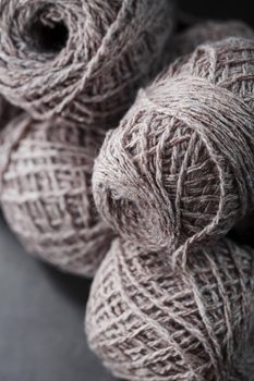 Light brown wool yarn made of threads in tangles. Needlework