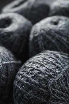 Tangles of gray yarn made of natural wool close-up in full screen.