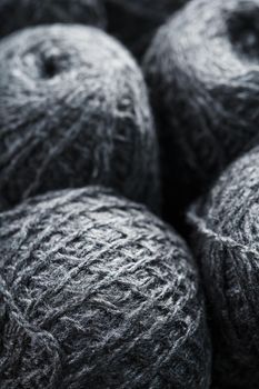 Tangles of gray yarn made of natural wool close-up in full screen.