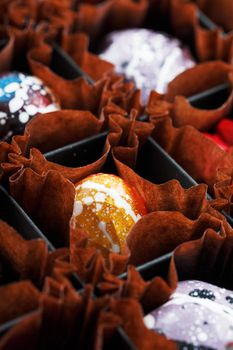 Sweet handmade chocolates in a box. The art of chocolate