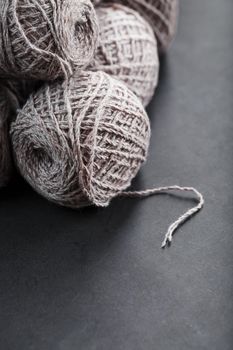 Light brown yarn made of natural sheep wool. Needlework