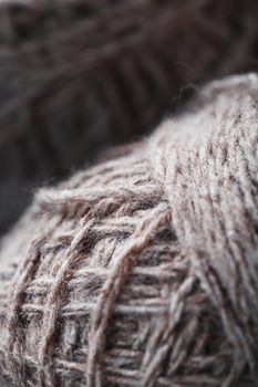 Light brown wool yarn made of threads in tangles. Needlework