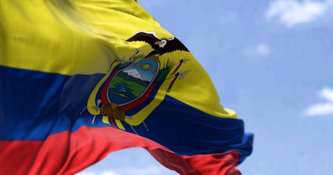 Detailed close up of the national flag of Ecuador waving in the wind on a clear day. Democracy and politics. South American country. Selective focus.