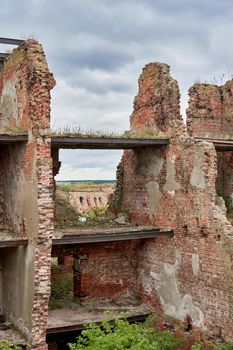 A destroyed brick building on the territory of the Oreshek fortress, red brick ruins