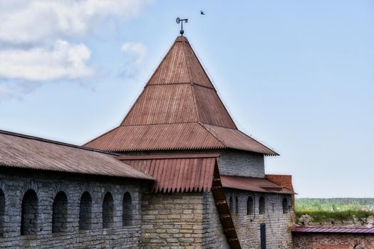 View of the old stone fortress with a watchtower. Fortress Oreshek on a sunny summer day