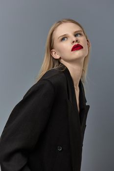 woman stylish black blazer red lips studio model unaltered. High quality photo