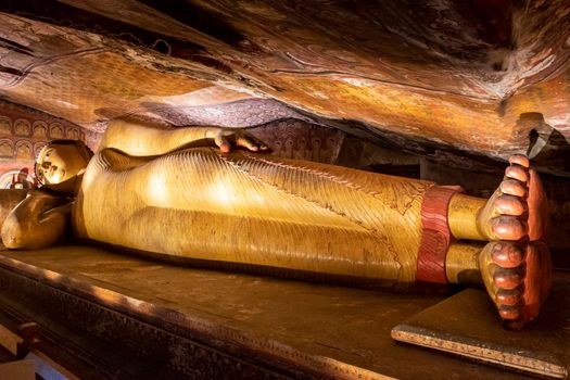 Sri Lanka. Dambulla Cave Temple. Lying Buddha statue in close-up. High quality photo