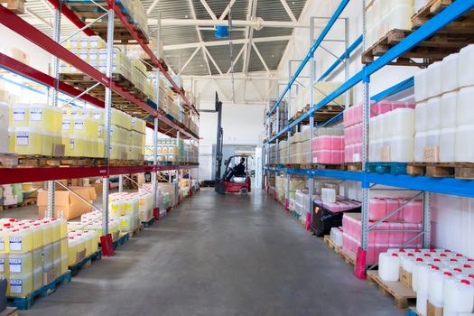 Belarus, the city of Mensk, April 12, 2019. Chemical production.Worker on a loader in a warehouse