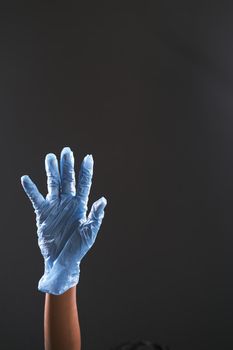 man doctor with medical gloves isolated on black .
