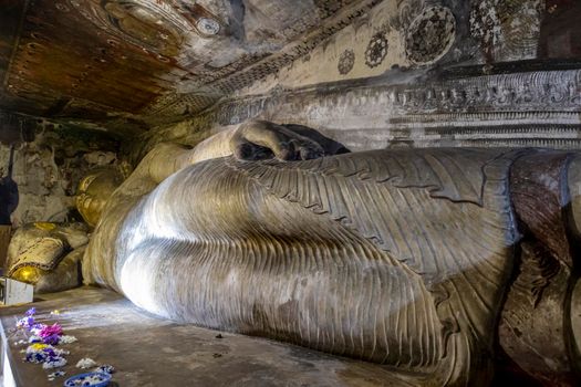 Sri Lanka. Dambulla Cave Temple. Lying Buddha statue in close-up. High quality photo