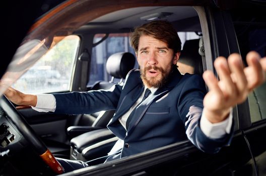 emotional man Driving a car trip luxury lifestyle success. High quality photo